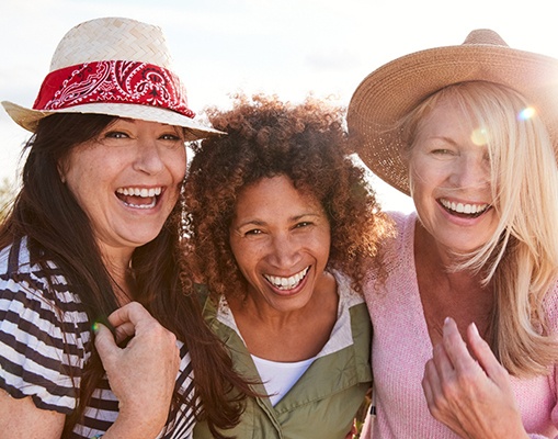 Woman in Frisco smiling with friends after BOTOX treatment 