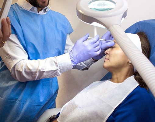 Dentist administering BOTOX 